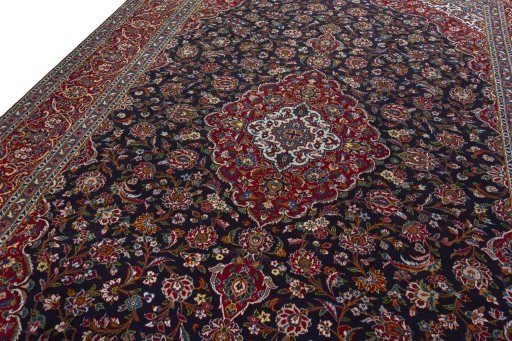 Backside of handmade 2000s Kashan rug showing knot structure and weave density