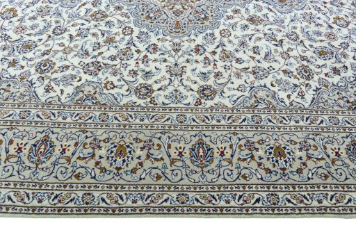 Corner detail of 2000s Kashan rug showing border pattern and Wool pile