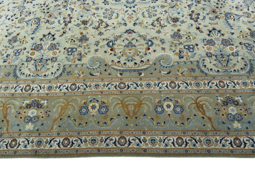 Corner detail of 2000s Kashan rug showing border pattern and Cork pile
