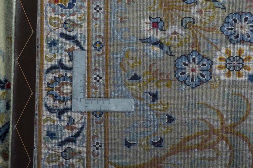Backside of handmade 2000s Kashan rug showing knot structure and weave density