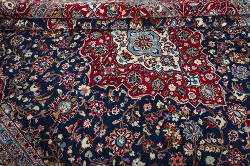 Close-up detail of 2000s Kashan rug from Iran / Persia showing Wool weave