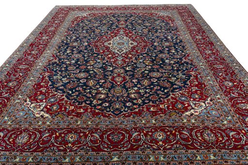 Surface texture of 2000s Kashan rug with natural Wool and intricate pattern