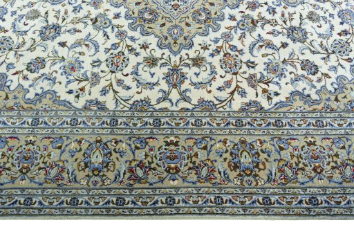 Corner detail of 2000s Kashan rug showing border pattern and Wool pile