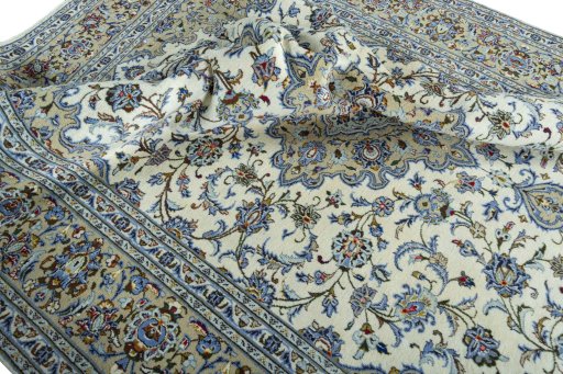 Surface texture of 2000s Kashan rug with natural Wool and intricate pattern