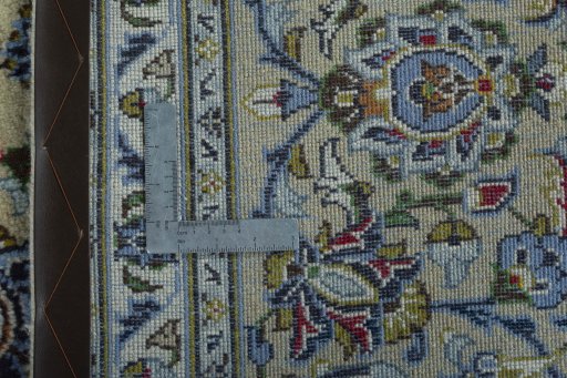 Backside of handmade 2000s Kashan rug showing knot structure and weave density
