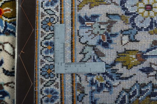 Backside of handmade 2000s Kashan rug showing knot structure and weave density