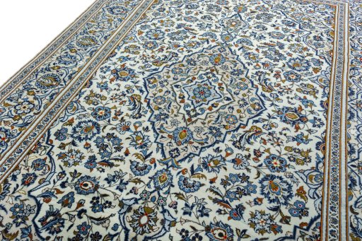 Backside of handmade 2000s Kashan rug showing knot structure and weave density