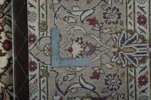 Backside of handmade 2000s Kashan rug showing knot structure and weave density