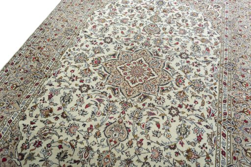 Backside of handmade 2000s Kashan rug showing knot structure and weave density