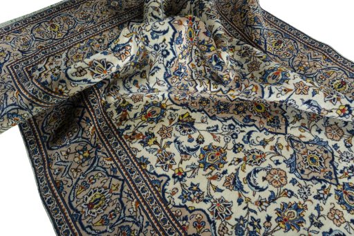 Surface texture of 2000s Kashan rug with natural Wool and intricate pattern