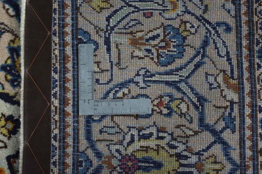 Backside of handmade 2000s Kashan rug showing knot structure and weave density