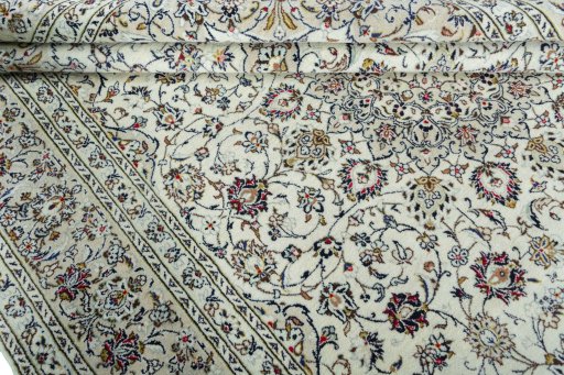 Close-up detail of 2000s Kashan rug from Iran / Persia showing Wool weave