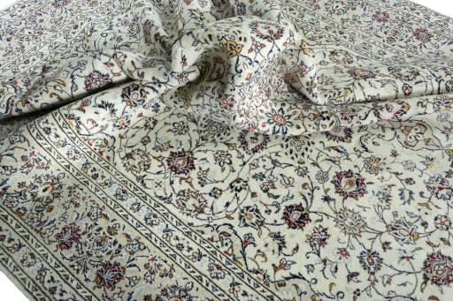 Surface texture of 2000s Kashan rug with natural Wool and intricate pattern