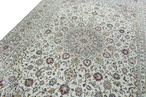 Backside of handmade 2000s Kashan rug showing knot structure and weave density