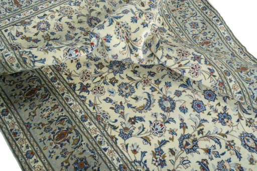 Surface texture of 2000s Kashan rug with natural Wool and intricate pattern