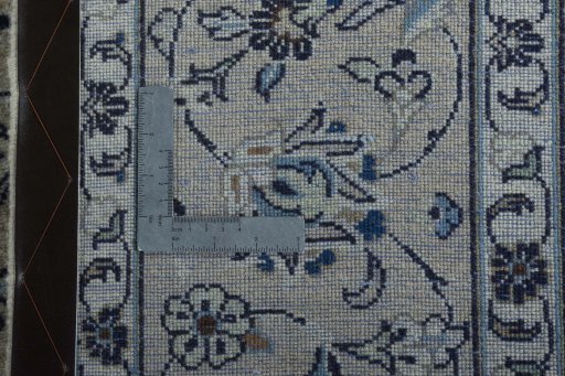 Backside of handmade 2000s Kashan rug showing knot structure and weave density