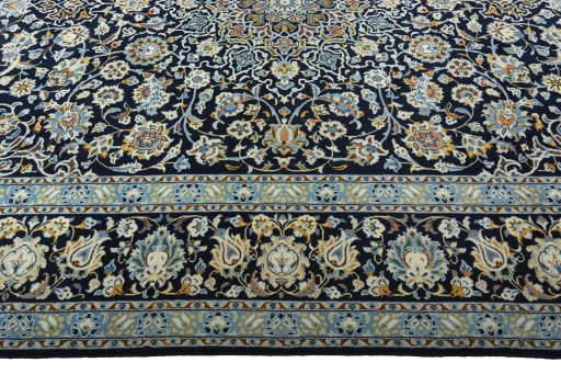 Corner detail of 2000s Kashan rug showing border pattern and Wool pile