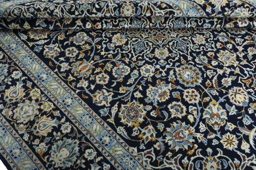 Close-up detail of 2000s Kashan rug from Iran / Persia showing Wool weave