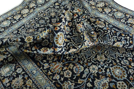 Surface texture of 2000s Kashan rug with natural Wool and intricate pattern