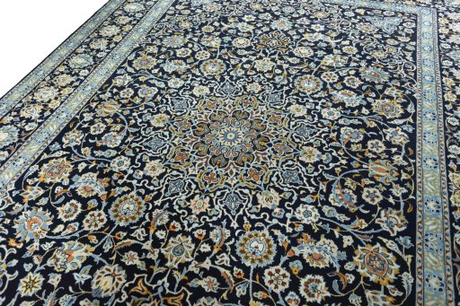 Backside of handmade 2000s Kashan rug showing knot structure and weave density