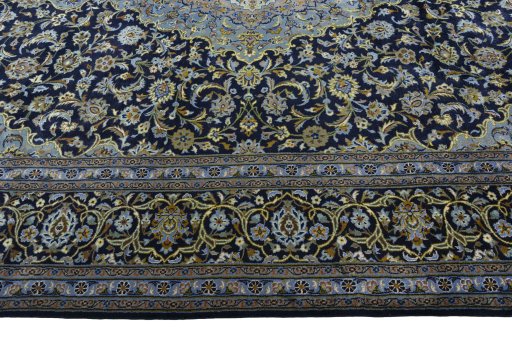 Corner detail of 1970s Kashan rug showing border pattern and Wool pile