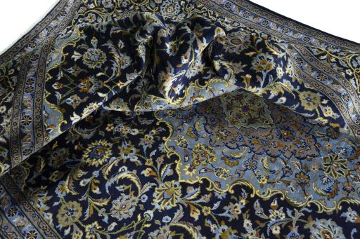 Surface texture of 1970s Kashan rug with natural Wool and intricate pattern