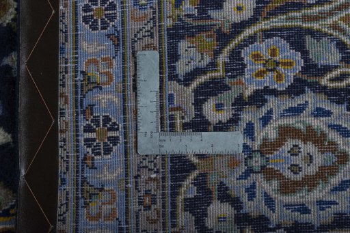 Backside of handmade 1970s Kashan rug showing knot structure and weave density