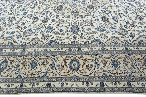 Corner detail of 2000s Kashan rug showing border pattern and Wool pile