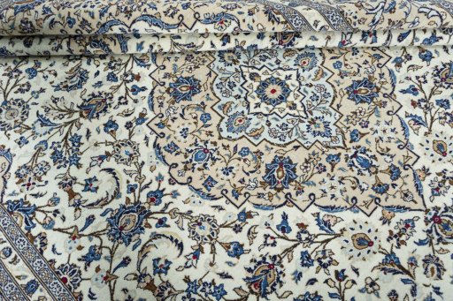 Close-up detail of 2000s Kashan rug from Iran / Persia showing Wool weave