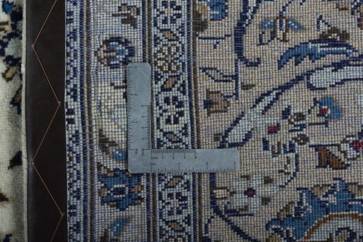 Backside of handmade 2000s Kashan rug showing knot structure and weave density