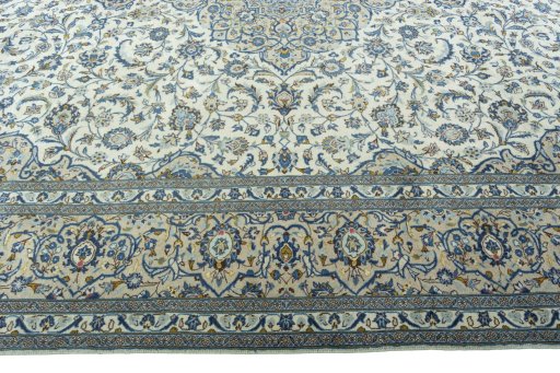 Corner detail of 2000s Kashan rug showing border pattern and Wool pile