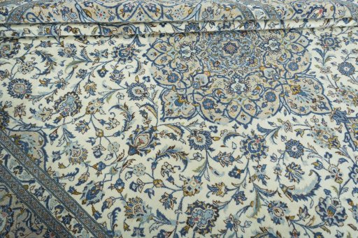Close-up detail of 2000s Kashan rug from Iran / Persia showing Wool weave