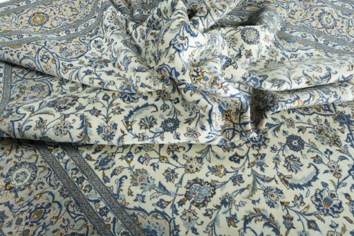 Surface texture of 2000s Kashan rug with natural Wool and intricate pattern
