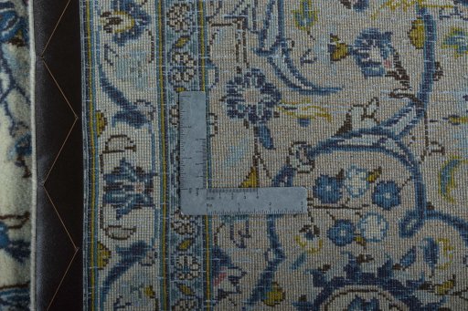 Backside of handmade 2000s Kashan rug showing knot structure and weave density