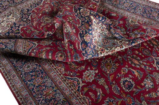 Surface texture of 1950s Kashan rug with natural Wool and intricate pattern