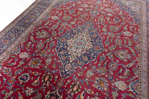 Backside of handmade 1950s Kashan rug showing knot structure and weave density