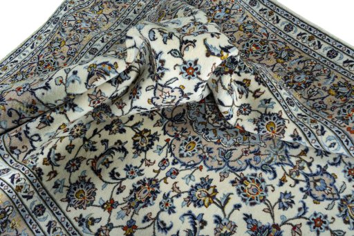 Surface texture of 2000s Kashan rug with natural Wool and intricate pattern
