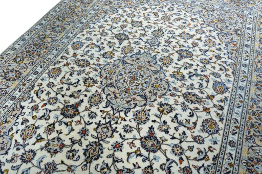 Backside of handmade 2000s Kashan rug showing knot structure and weave density
