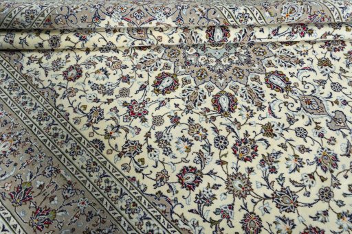 Close-up detail of 2000s Kashan rug from Iran / Persia showing Wool weave
