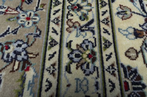 Backside of handmade 2000s Kashan rug showing knot structure and weave density