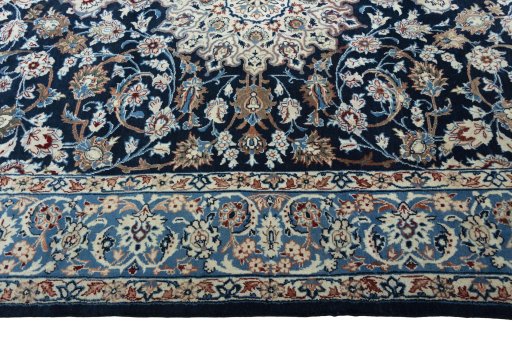 Corner detail of 1970s Kashan rug showing border pattern and Wool pile