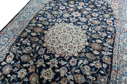 Backside of handmade 1970s Kashan rug showing knot structure and weave density