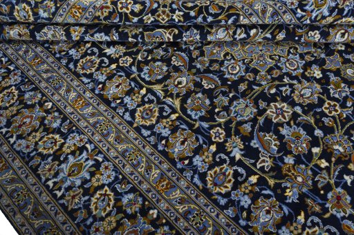 Close-up detail of 2000s Kashan rug from Iran / Persia showing Wool weave
