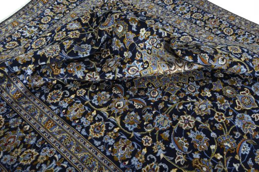 Surface texture of 2000s Kashan rug with natural Wool and intricate pattern