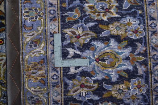 Backside of handmade 2000s Kashan rug showing knot structure and weave density
