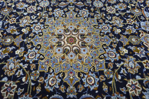 Central medallion detail of 2000s Kashan rug from Iran / Persia