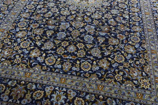 Close-up detail of 2000s Kashan rug from Iran / Persia showing Wool weave