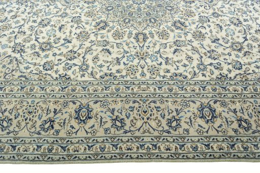 Corner detail of 2000s Kashan rug showing border pattern and Wool pile