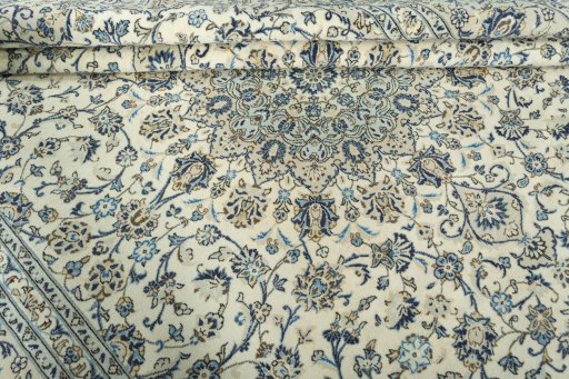Close-up detail of 2000s Kashan rug from Iran / Persia showing Wool weave