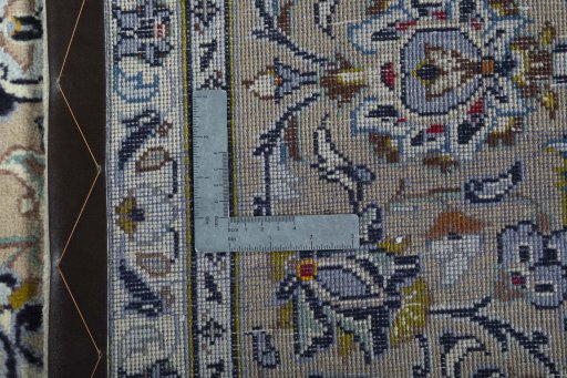 Backside of handmade 2000s Kashan rug showing knot structure and weave density